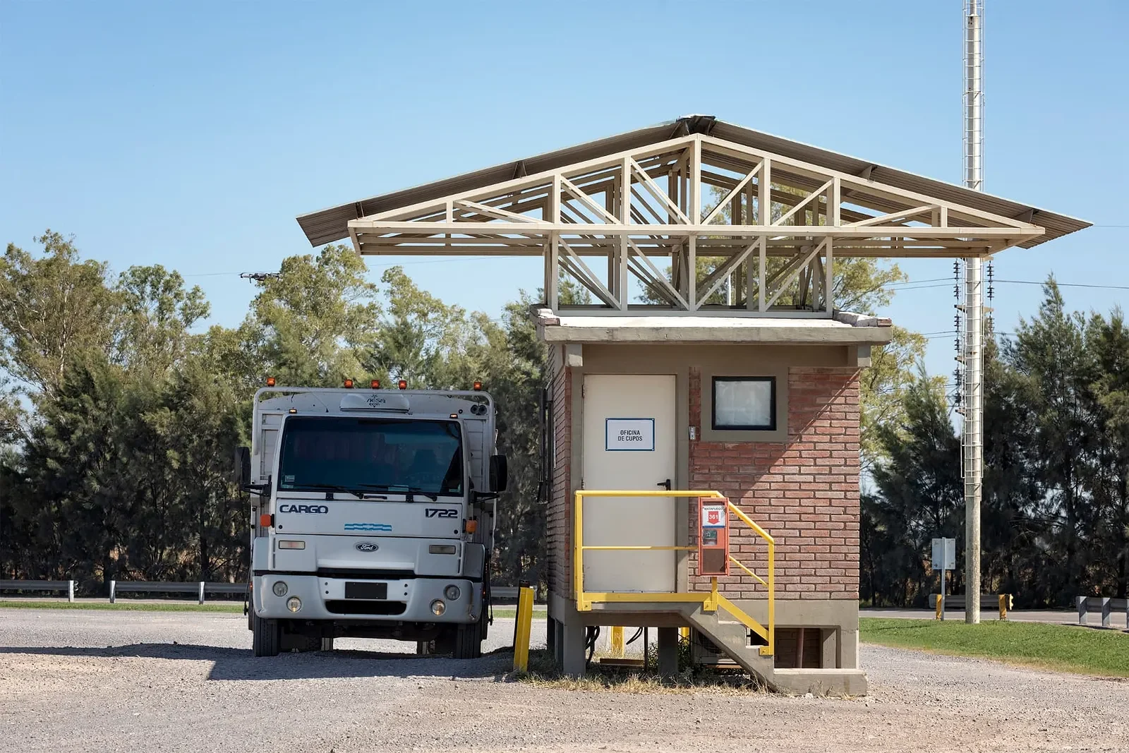 Truck beside the booking office in a port terminal holding area